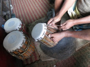Stretching of wet Skin on wooden Tabla Stretching of wet Skin on wooden Tabla