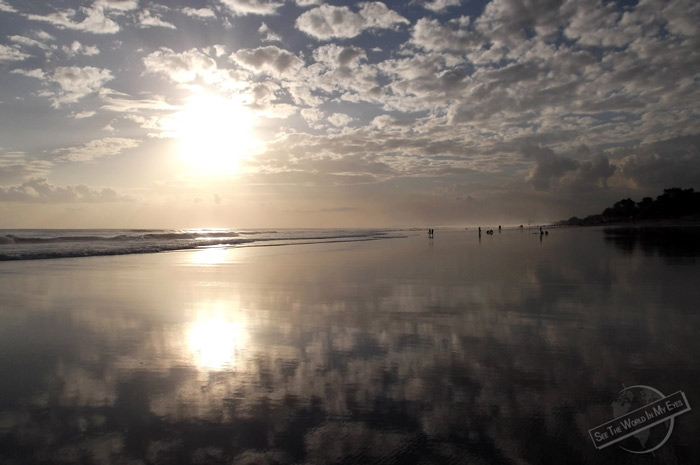 Cloudy Sky reflecting on the Water at the Beach in Kuta, Bali, Indonesia Cloudy Sky reflecting on the Water at the Beach in Kuta, Bali, Indonesia