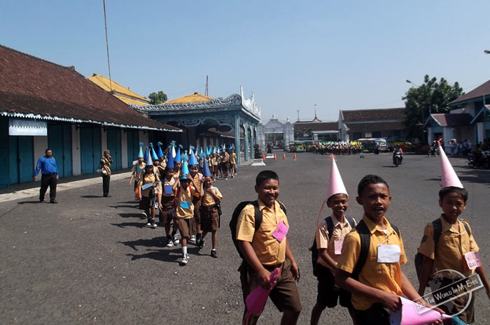 Friendly School Children with pointy Hats at the Kraton in Solo on Java, Indonesia Friendly School Children with pointy Hats at the Kraton in Solo on Java, Indonesia