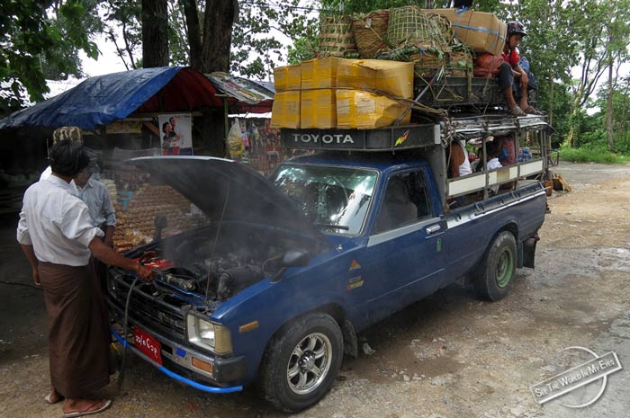Steaming, overheated Car by the Road in Myanmar Steaming, overheated Car by the Road in Myanmar